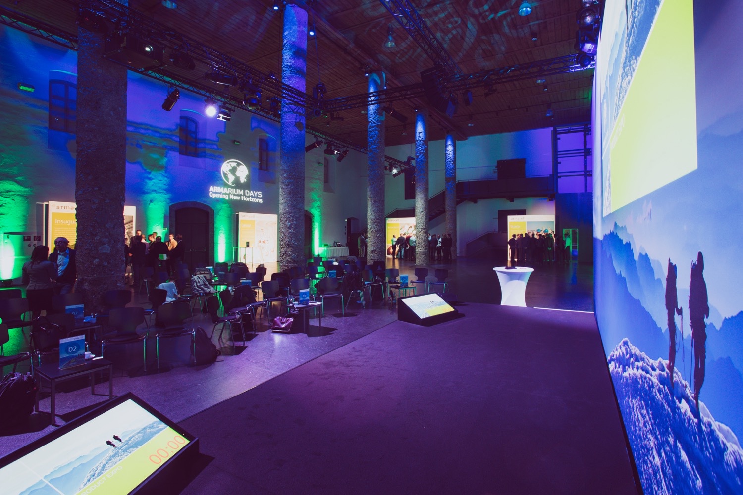 Armacell Executive Conference featuring a large stage screen and teleprompters A view from the stage at the Armacell Armarium Days executive conference, featuring a large screen, teleprompters and event set-up in Innsbruck.